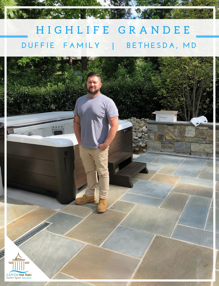 man standing next to hot tub on back slate patio in Bethesda, md