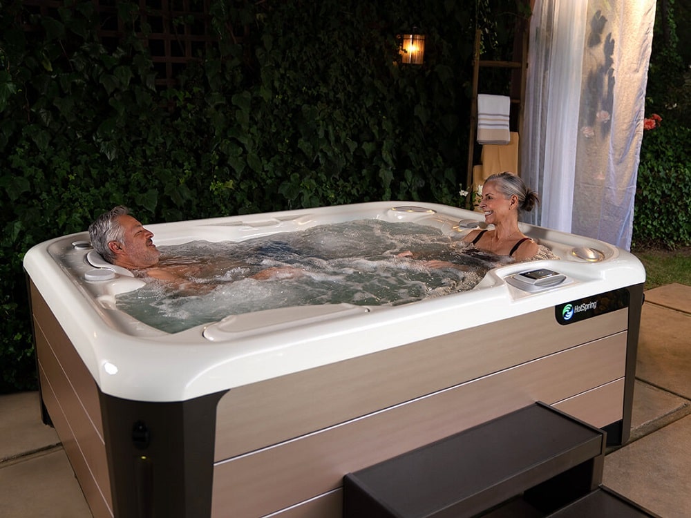 Man and woman sitting in hot tub