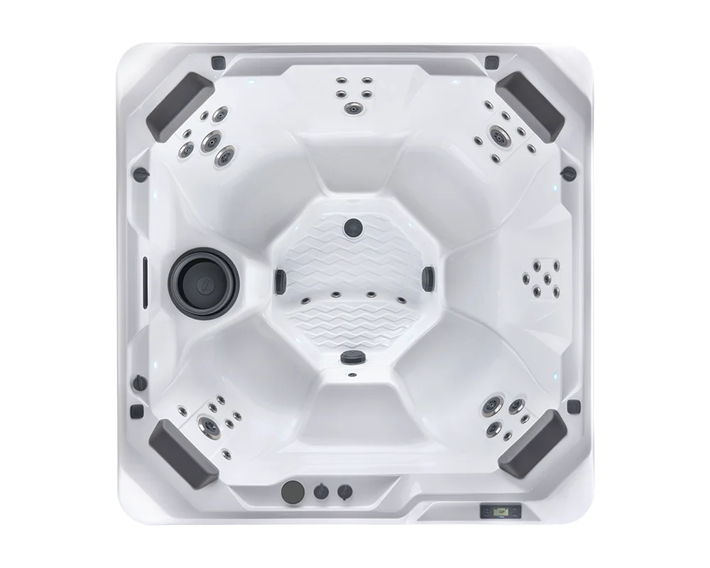 Top-down view of a white square hot tub with multiple jet-equipped seats and a central textured foot area, showing a control panel at the bottom edge.